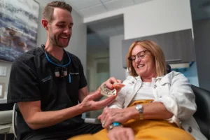 emergency dentist in jacksonville speaks with a patient