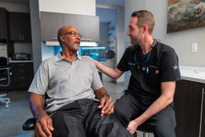emergency dentist in jacksonville speaks with a patient